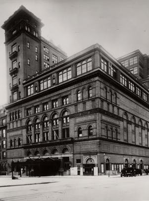 Photo of Carnegie Hall showing the building in its present configuration, following the completion of the studio tower additions in 1896.