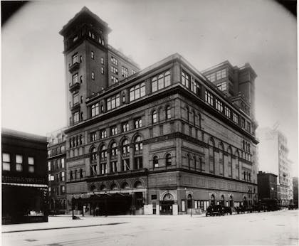 Photo of Carnegie Hall showing the building in its present configuration, following the completion of the studio tower additions in 1896.