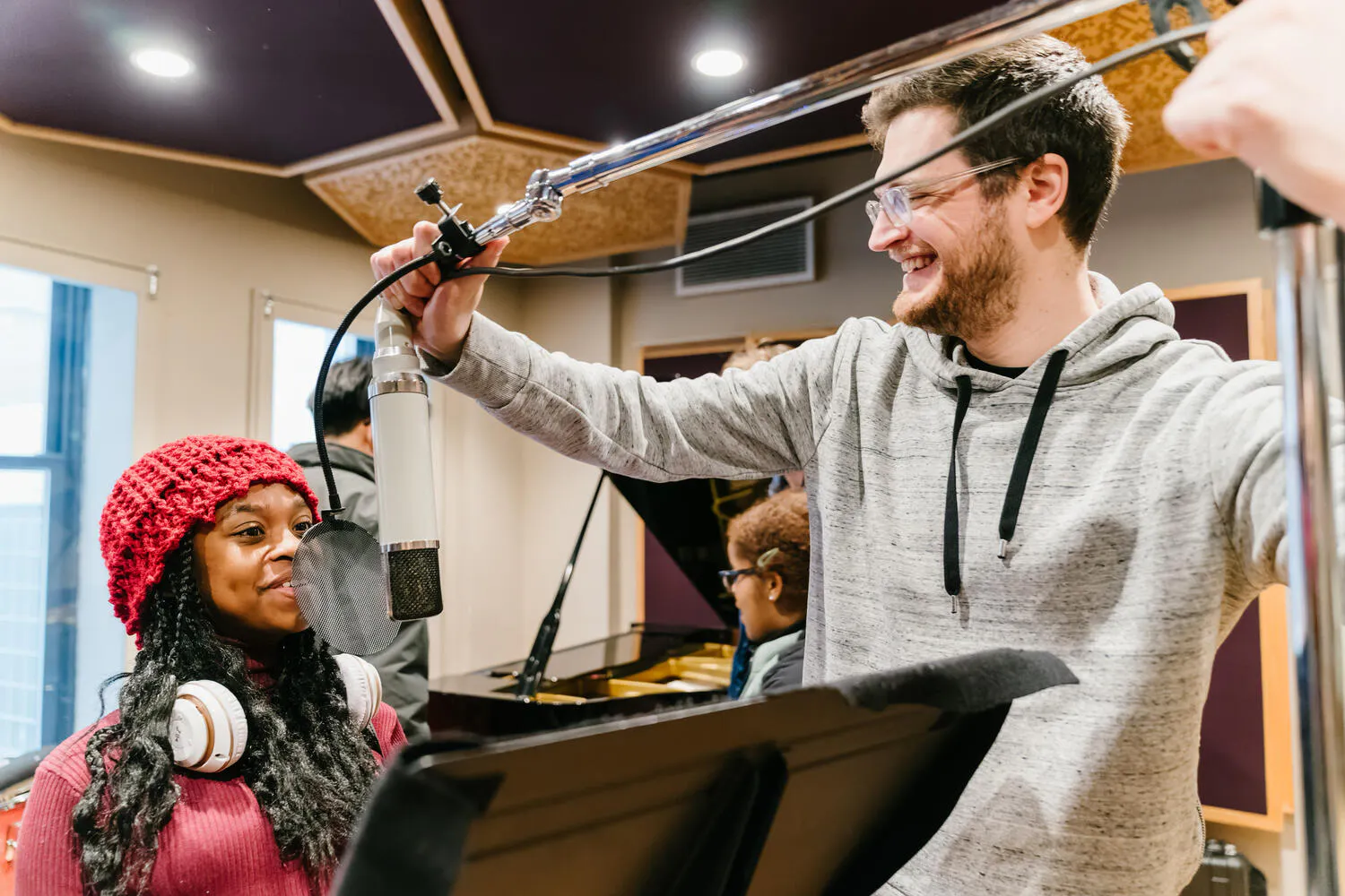 B-Side participants record with a microphone