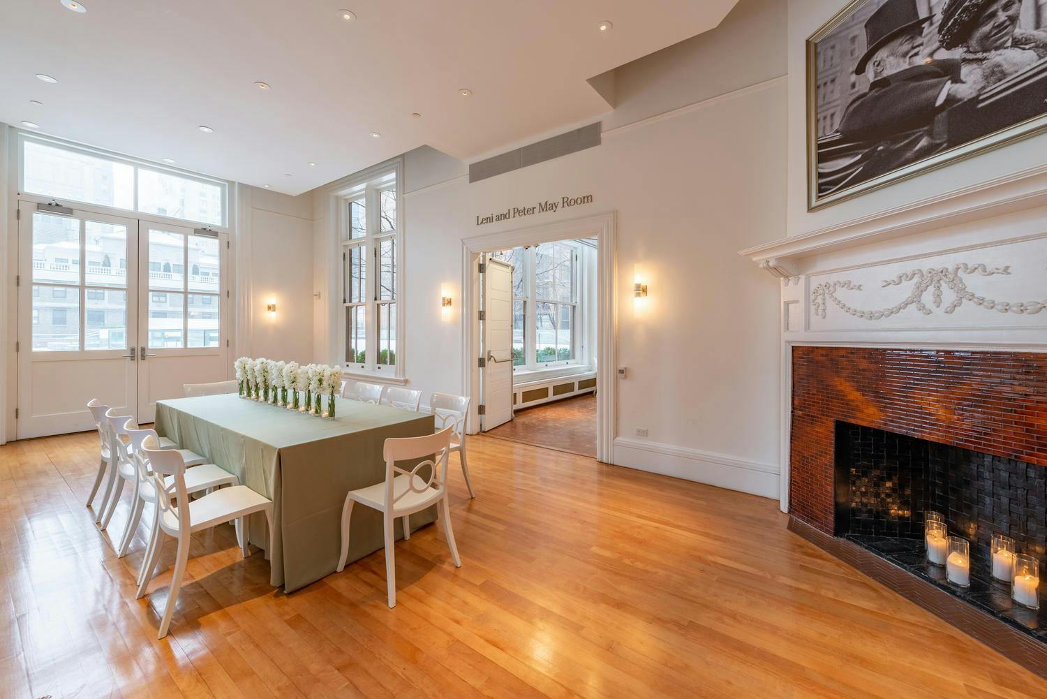 A portrait of Andrew and Louise Carnegie overlooks a bright May Room set for an intimate lunch