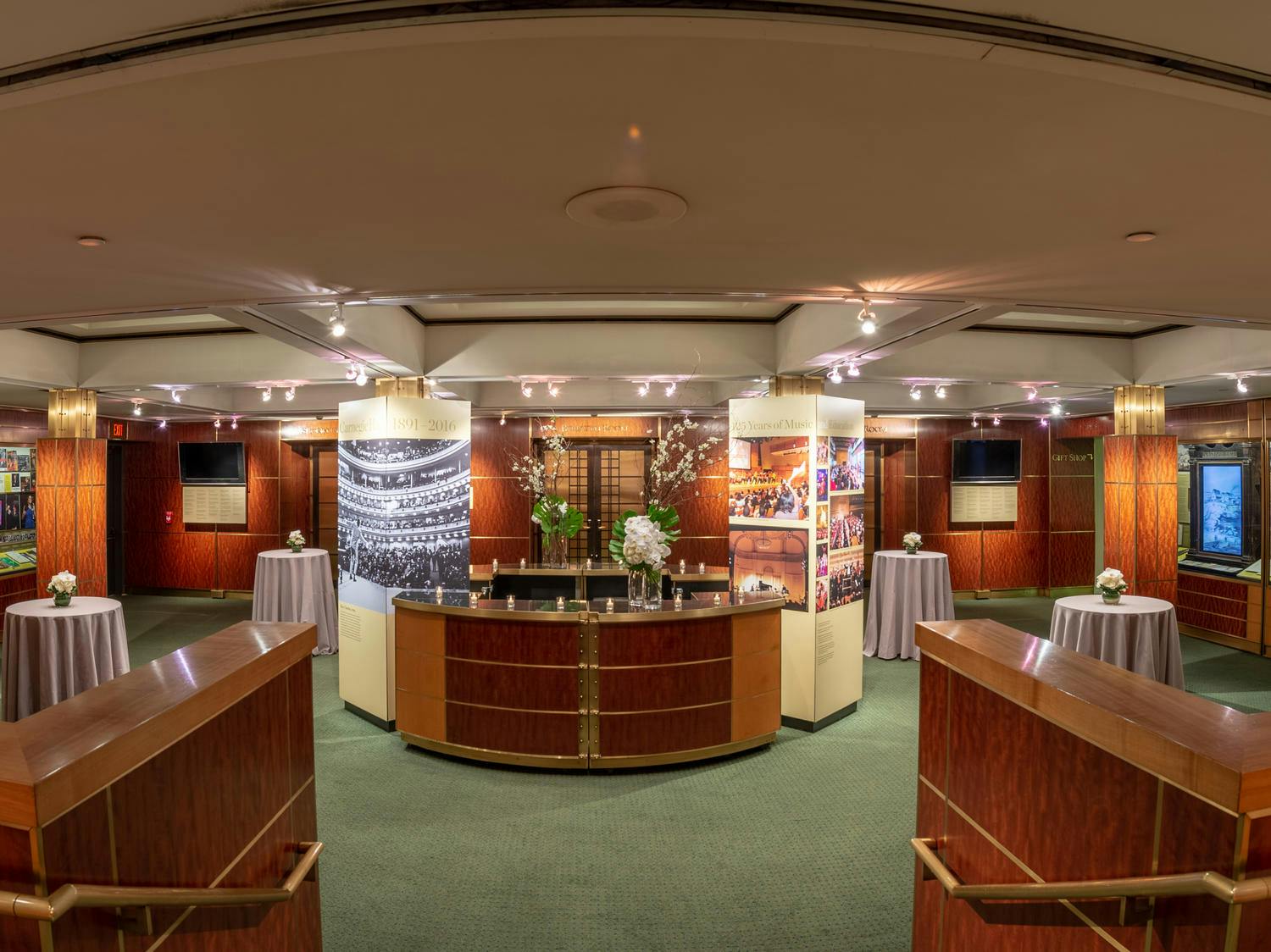 The Rose Museum set for a reception with bar, high cocktail tables, and green and white florals