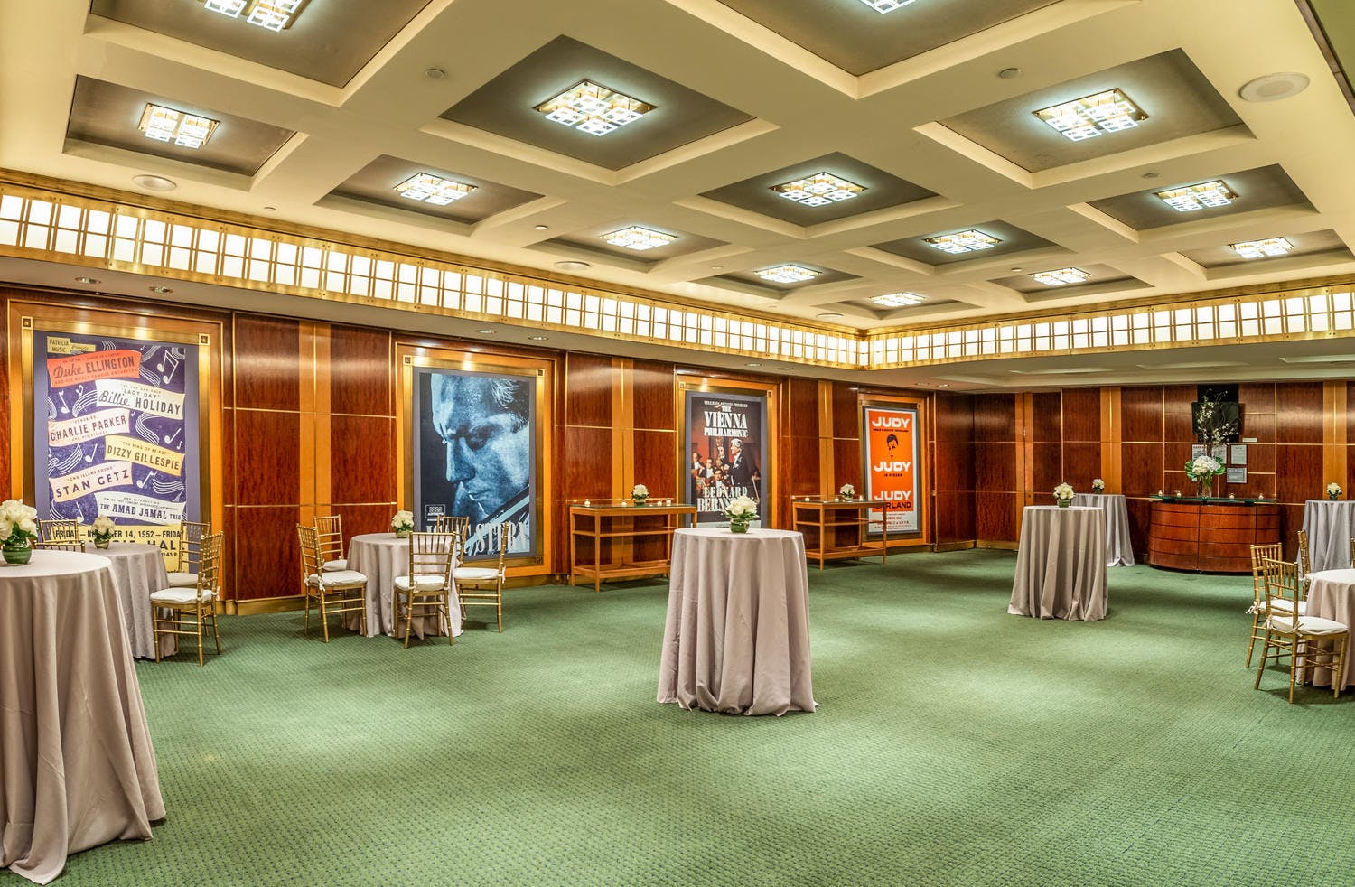 Rohatyn Room set with bar, buffet tables, and cocktail tables with florals for a reception