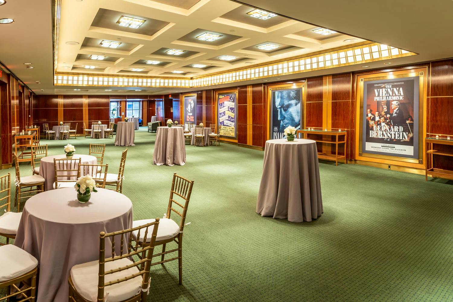 Rohatyn and Shorin Club rooms set for a reception with buffet tables, cocktail tables, and florals