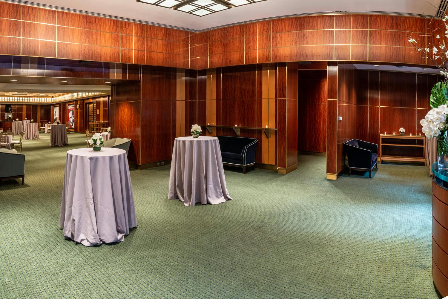 Shorin Club Room and Rohatyn Room set for a reception with seating and cocktail tables with florals