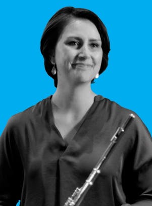 Ensemble Connect alum Catherine Gregory holding her flute