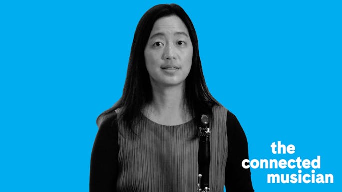 Ensemble Connect alum Alicia Lee holding her clarinet