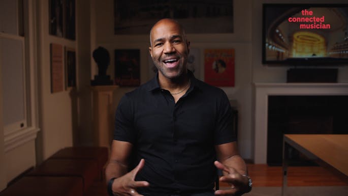 Daniel Bartholomew-Poyser smiles while speaking to camera.