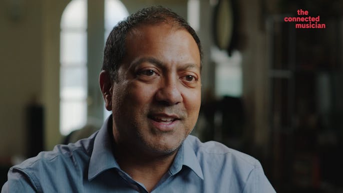 Abhijit Sengupta speaks to camera.