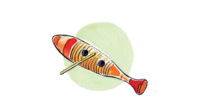 A stick resting on a guiro