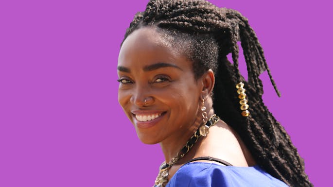 Emeline against a purple background