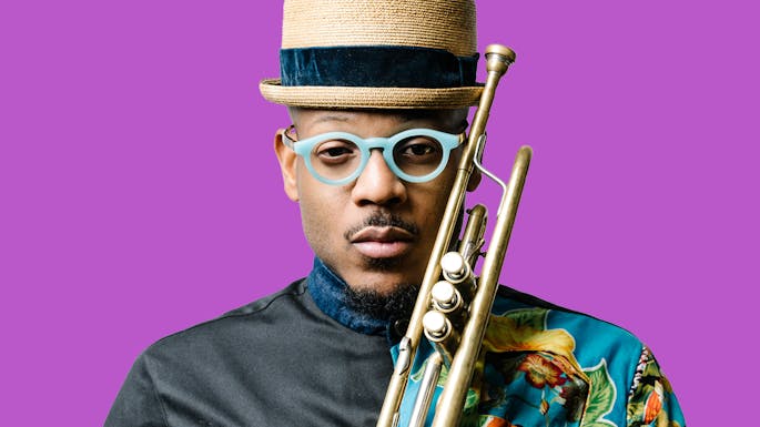 Etienne against a purple background