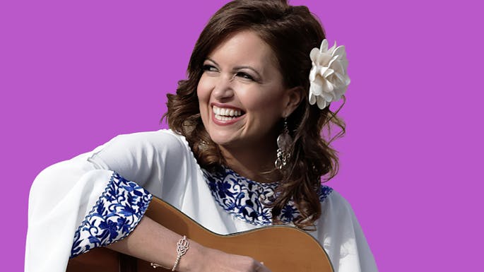 Farah Siraj plays guitar