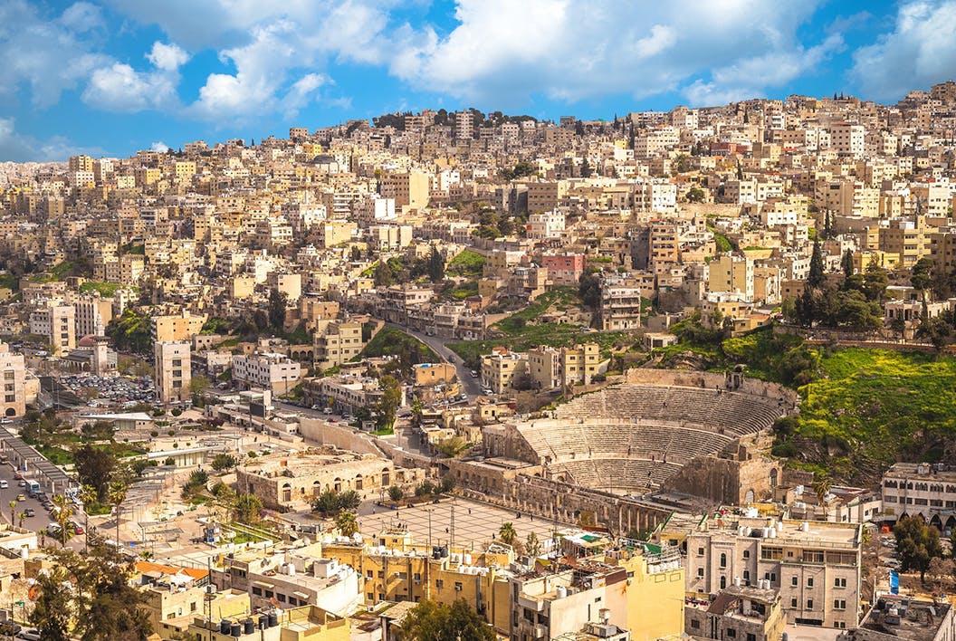 The skyline of Amman, Jordan, with ruins of a Roman amphitheater