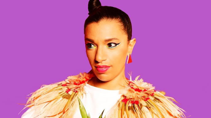 Magda  against a purple background