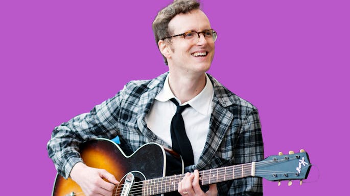 Michael  against a purple background