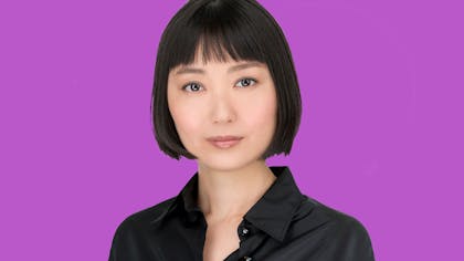 Qian Yi against a purple background