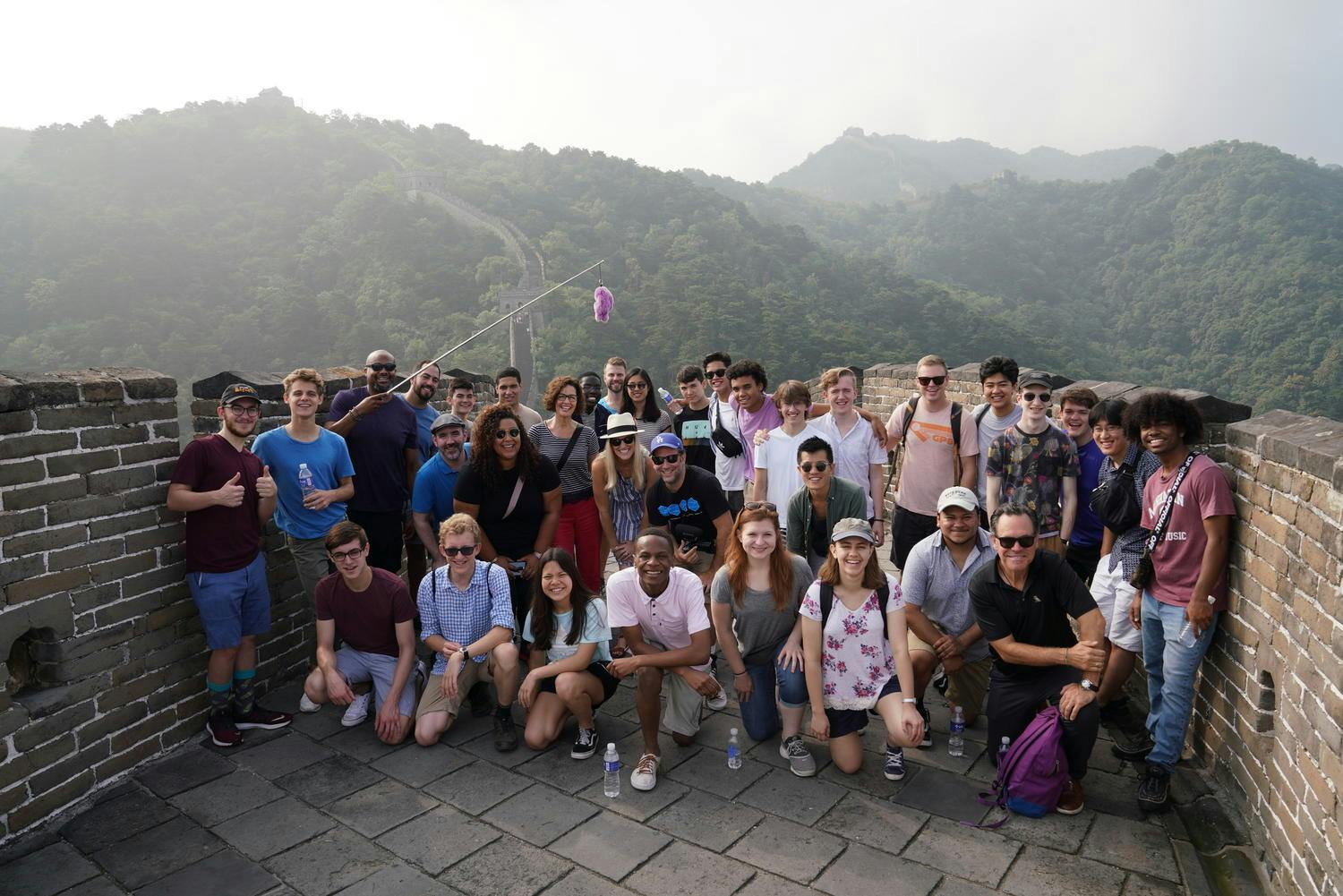 Musicians of NYO Jazz at the Great Wall of China, mountains in the background