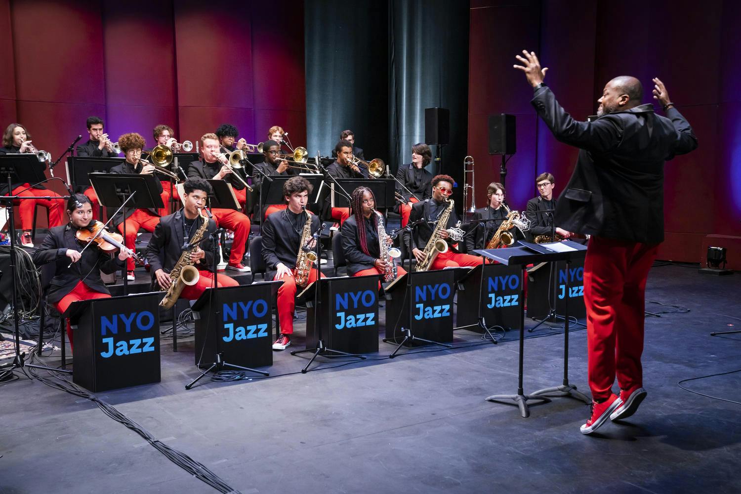 Sean Jones conducts the NYO Jazz musicians in a studio