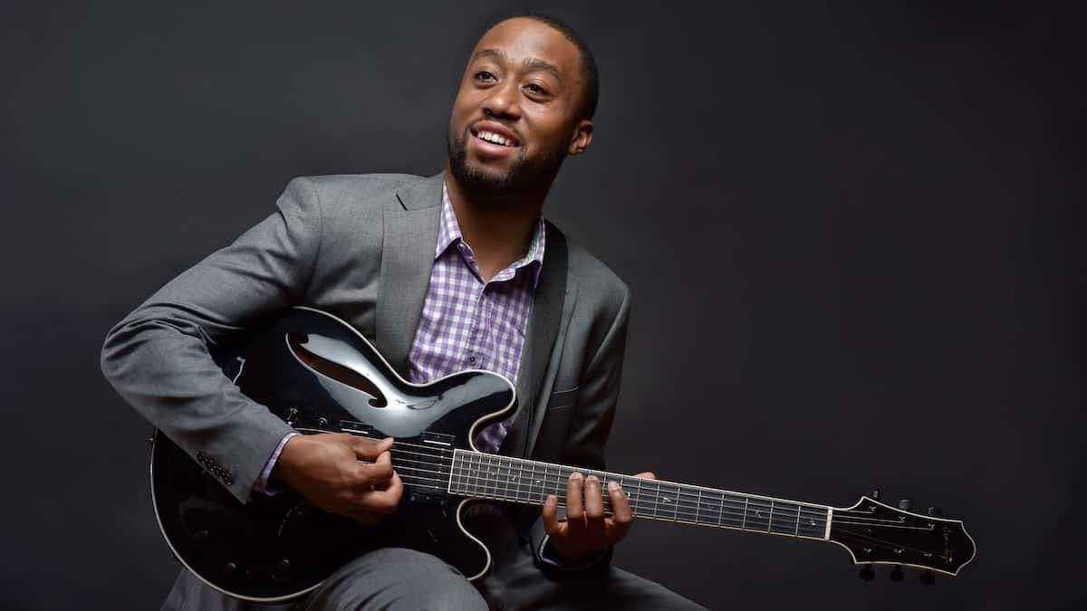 Dan Wilson, smiling, with guitar