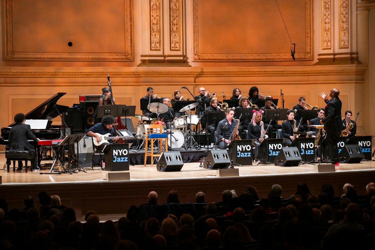 Sean Jones conducts the NYO Jazz All Star band on stage at Carnegie Hall