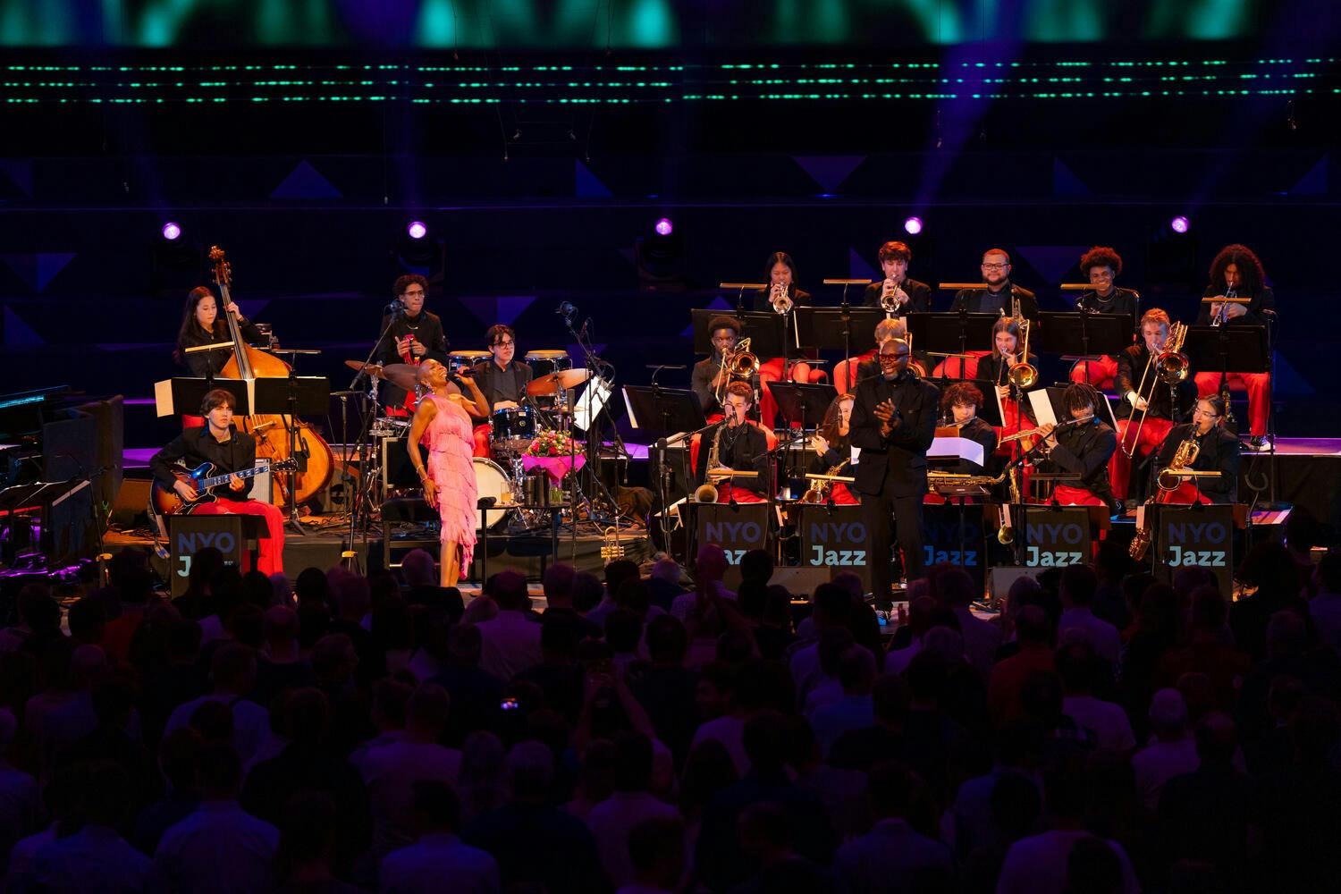 Dee Dee Bridgewater and the NYO Jazz Band perform on stage before an audience