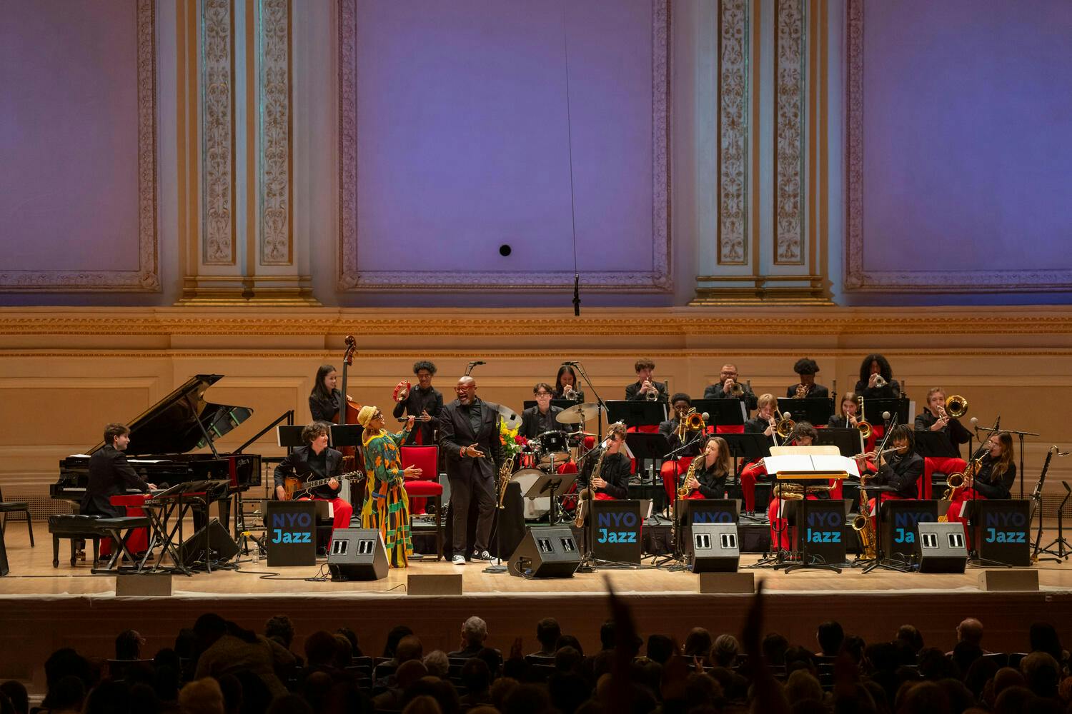 Dee Dee Bridgewater gestures to Sean Jones on stage at Carnegie Hall as the band performs