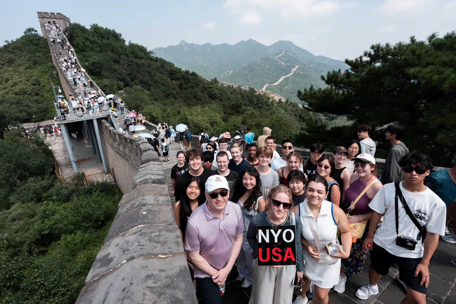 NYO-USA musicians pose together on the Great Wall of China