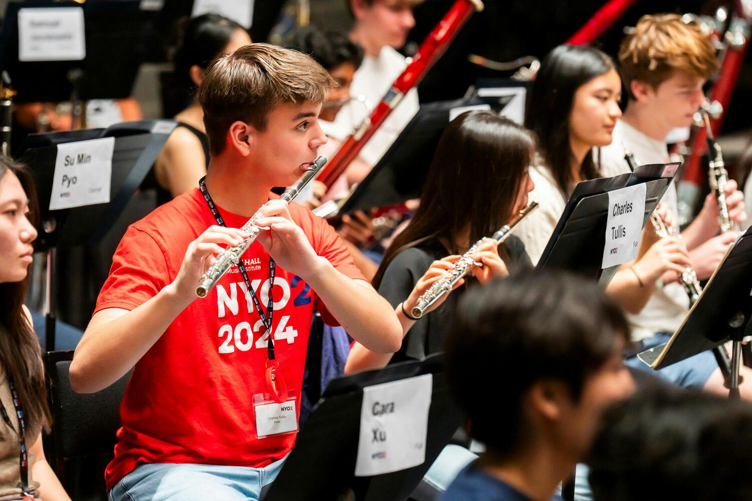 NYO2 flutists perform on stage