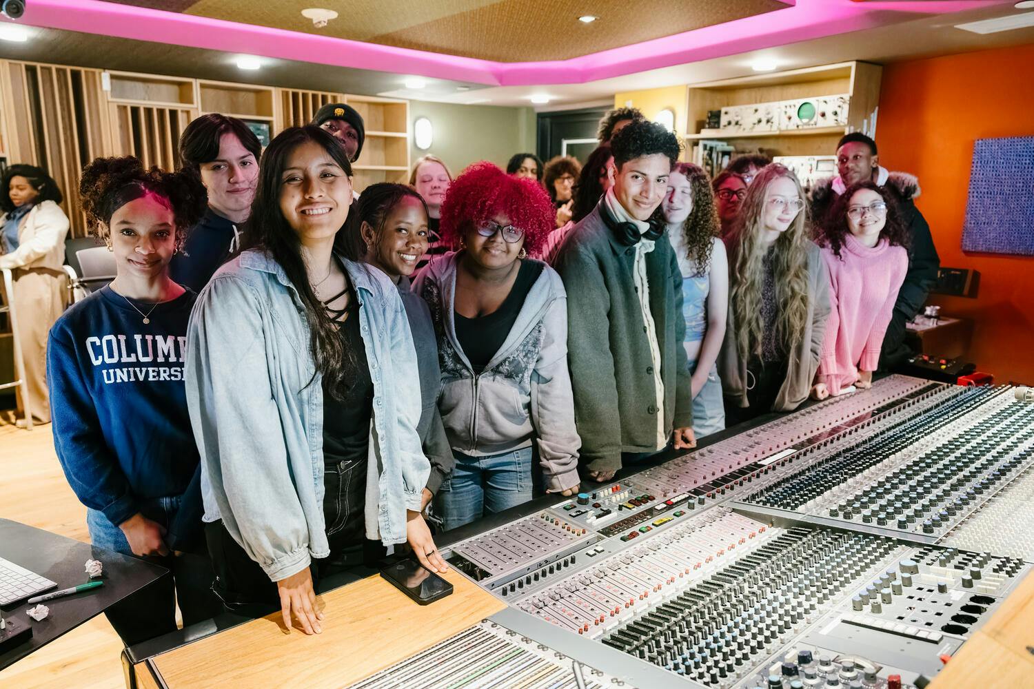 The B-Side participants gather together before a mixing board