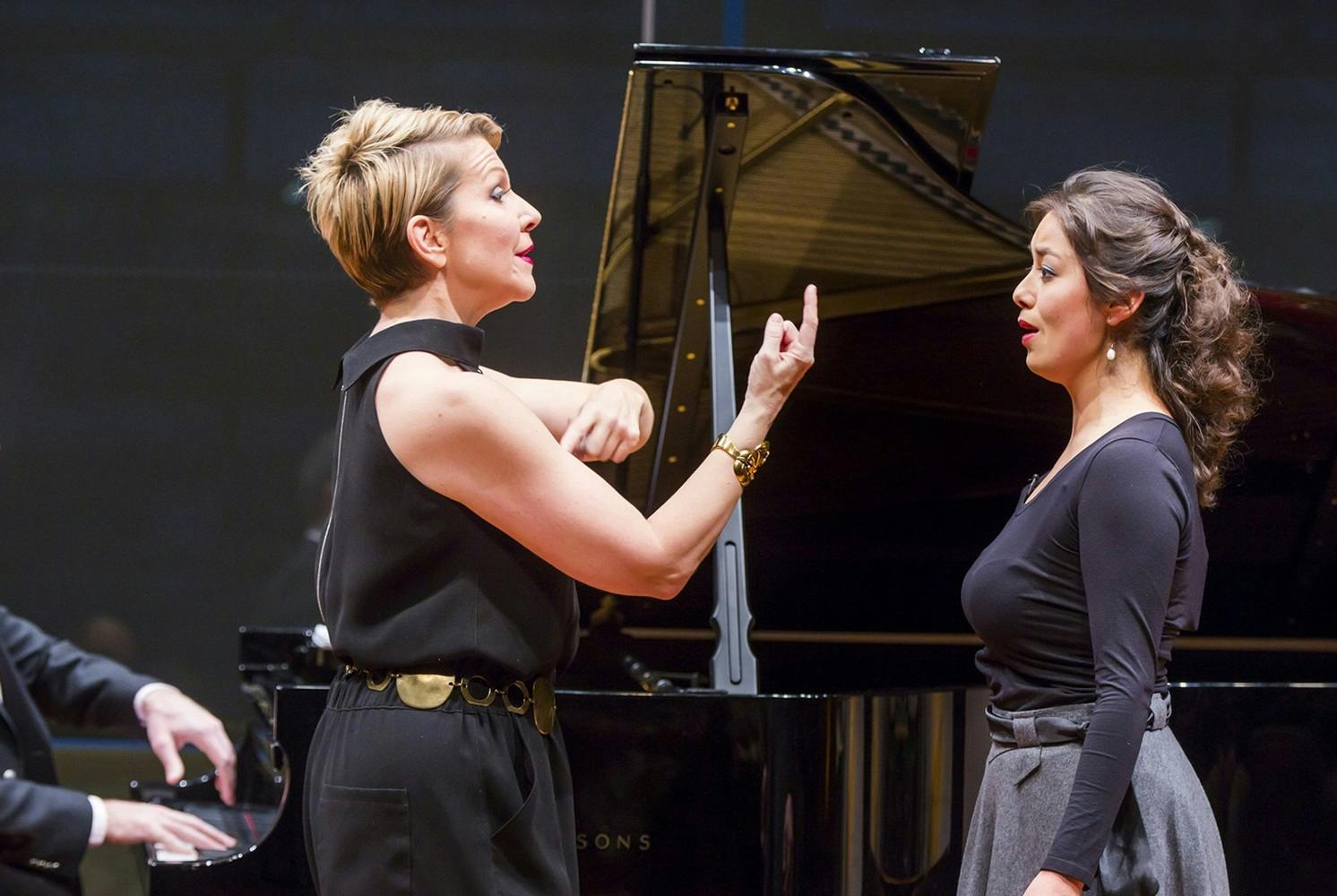 Joyce DiDonato coaches a young female singer as a man plays piano