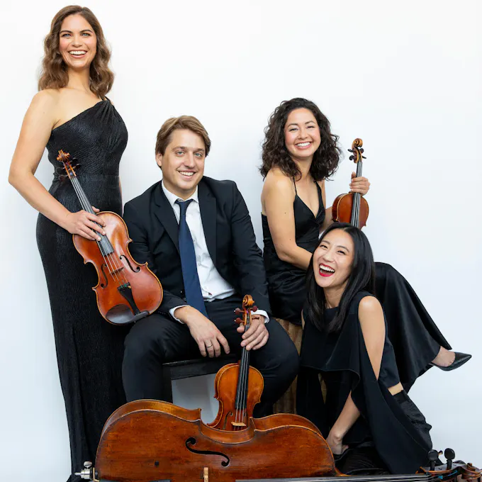 The musicians of Aeolus Quartet holding their instruments