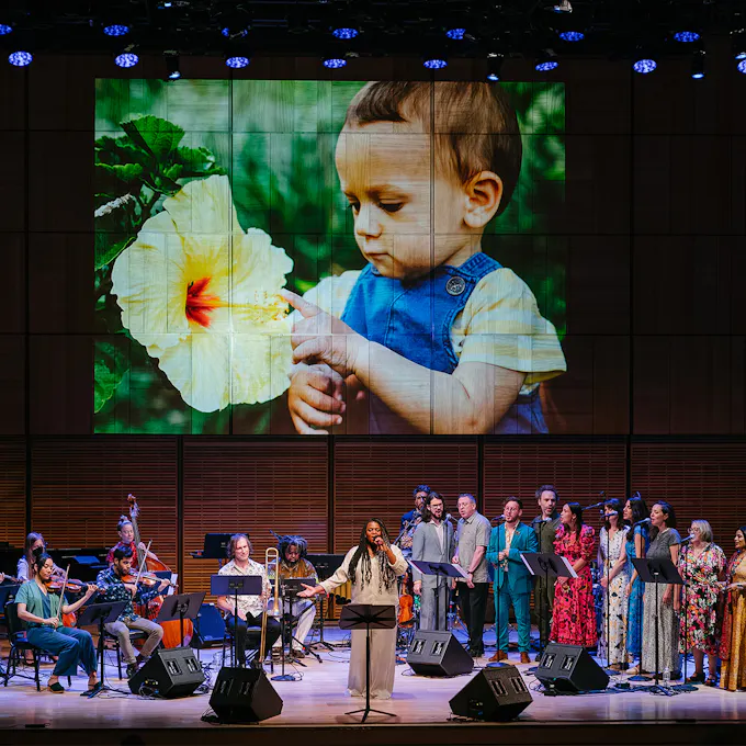 Ruby and Sonia De Los Santos perform at microphones