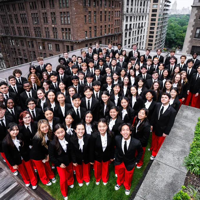 The musicians of NYO-USA standing on the rooftop terrace of Carnegie Hall