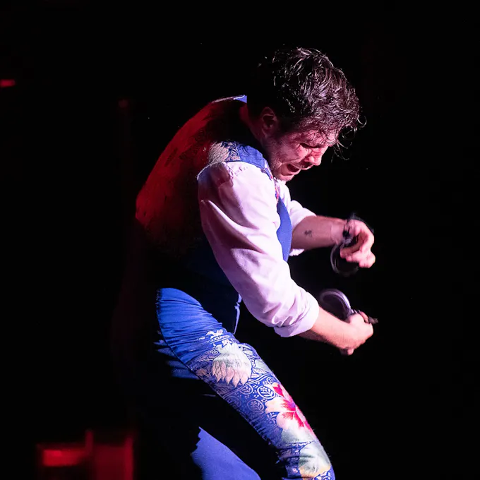 A man dances flamenco on stage
