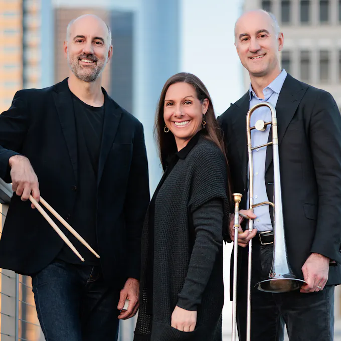 The Jody Redhage Ferber Trio pose together, smiling