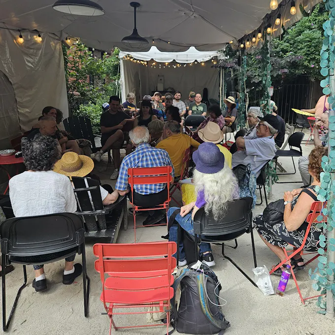 A gathering of people under a tent