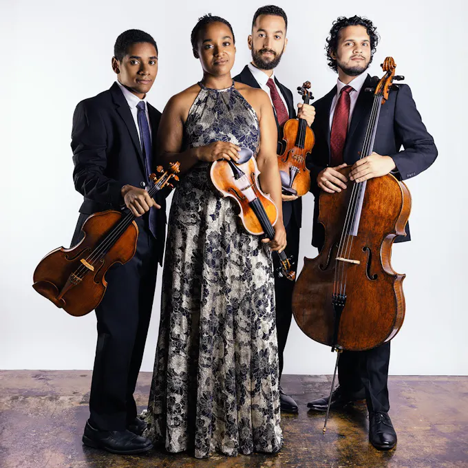 Musicians of Ivalas Quartet pose together with their instruments