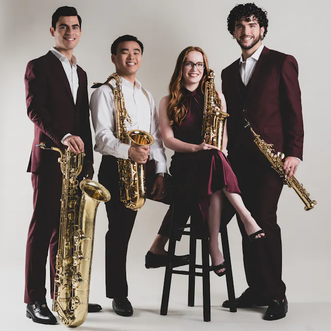 Musicians of Cerus Quartet pose together with their instruments