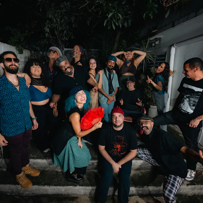 Musicians of El Laberinto del Coco pose together outside