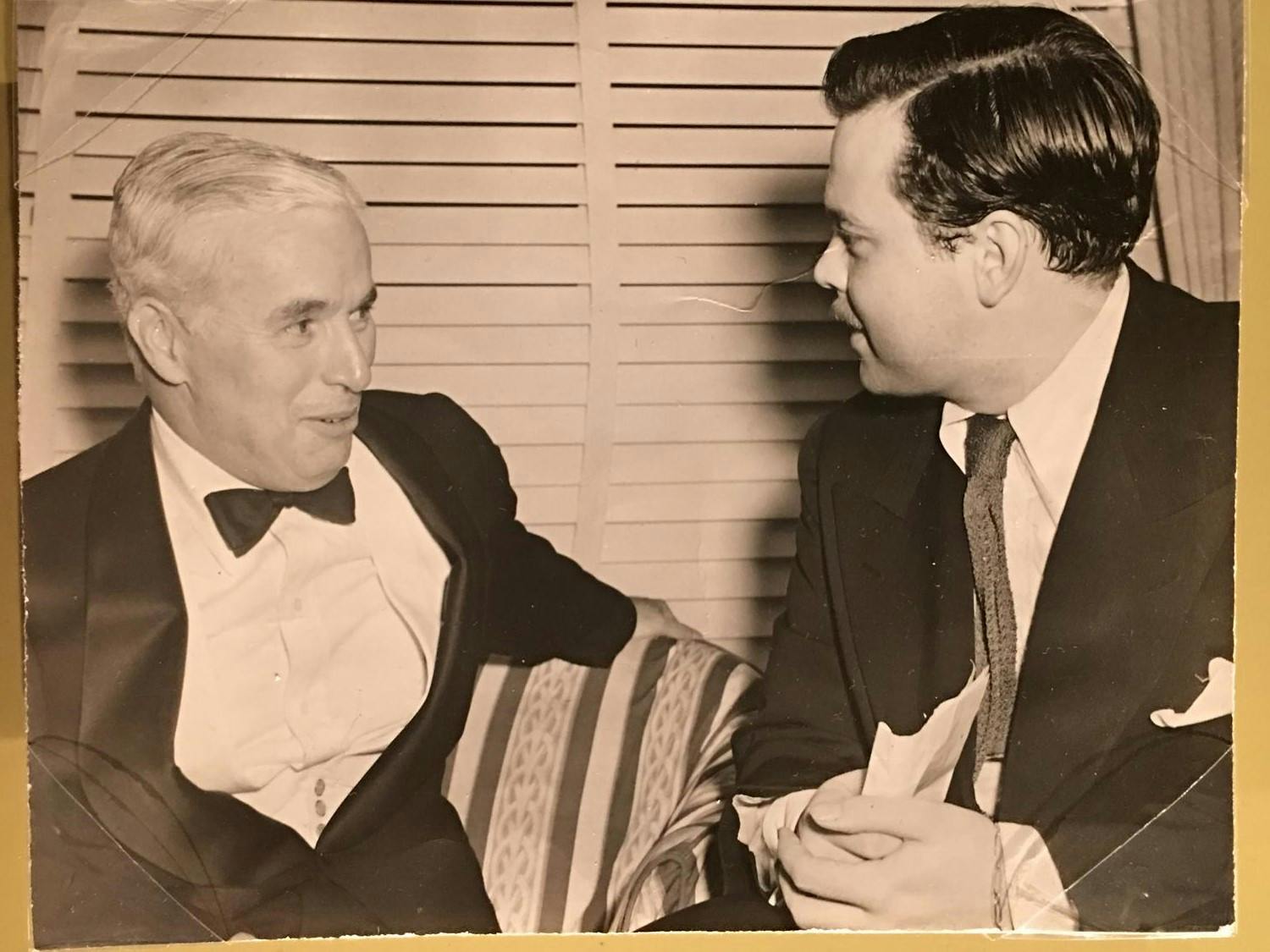 Photograph of Charlie Chaplin and Orson Welles backstage at Carnegie Hall