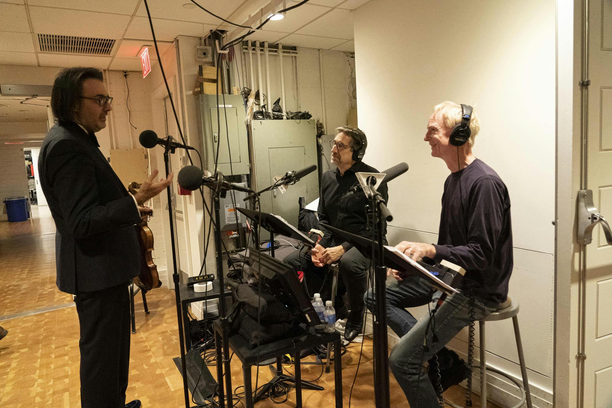 Jeff Spurgeon and John Schaefer chatting with Leonidas Kavakos as they record backstage