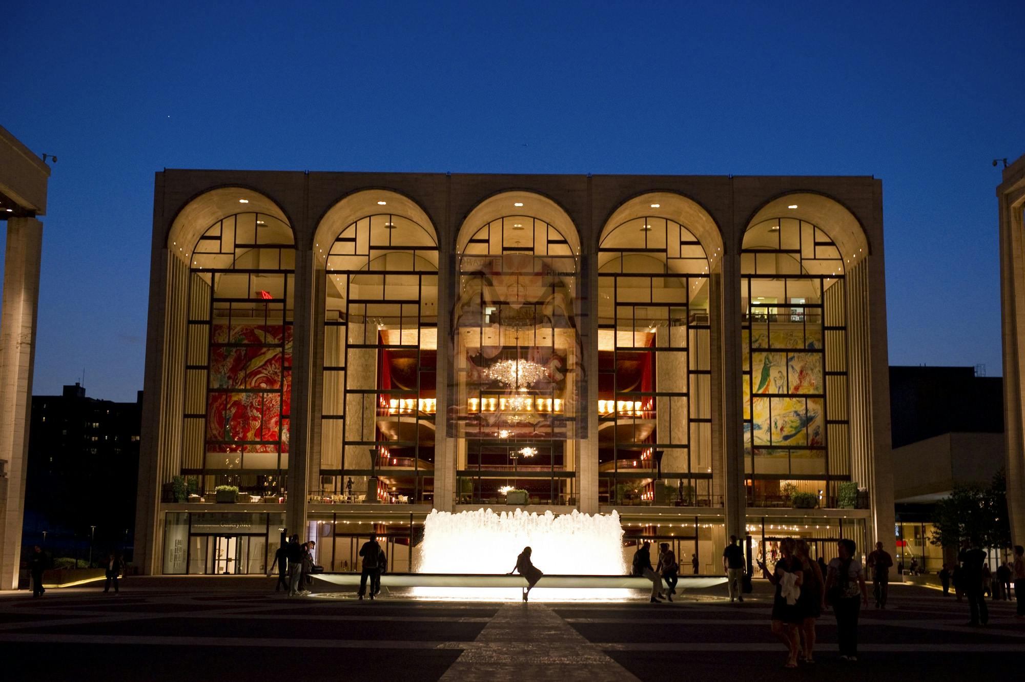 An image of the Metropolitan Opera House at night.