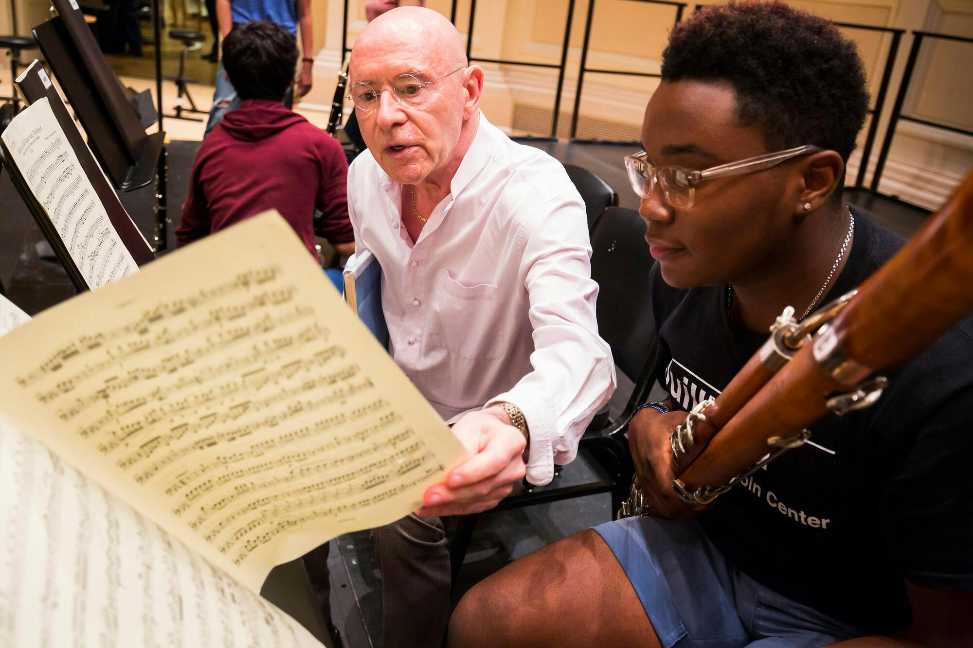 Christoph Eschenbach speaks with NYO-USA bassoonist Joshua Elmore during a rehearsal at Carnegie Hall, 2016