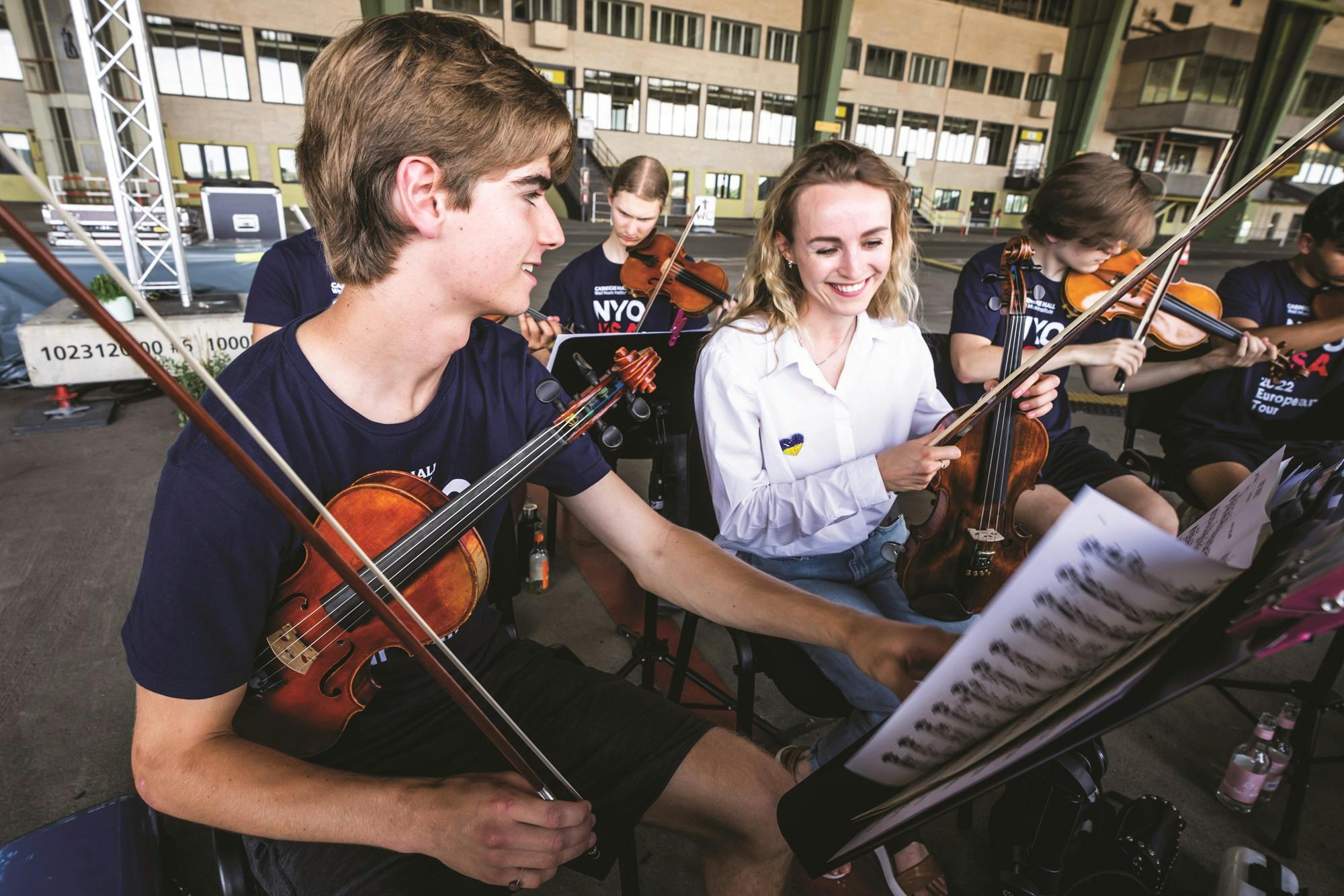 NYO-USA members in an outdoor rehearsal