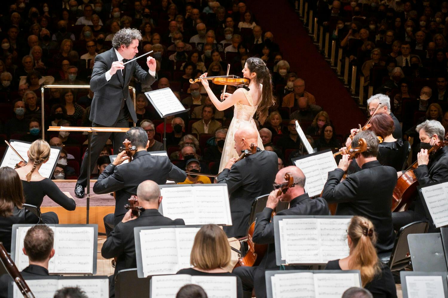 Gustavo Dudamel conducting the LA Phil with violinist María Dueñas as soloist.