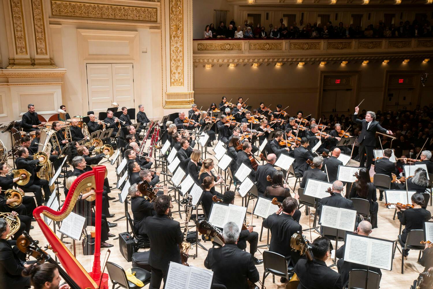 Gustavo Dudamel conducting the Los Angeles Philharmonic at Carnegie Hall.