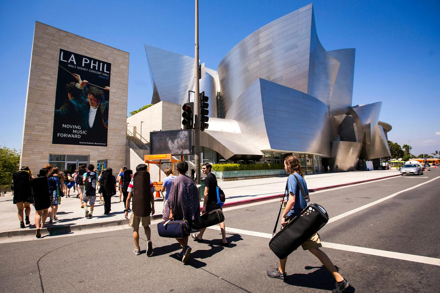 NYO-USA members walking across the street to Walt Disney Concert Hall.