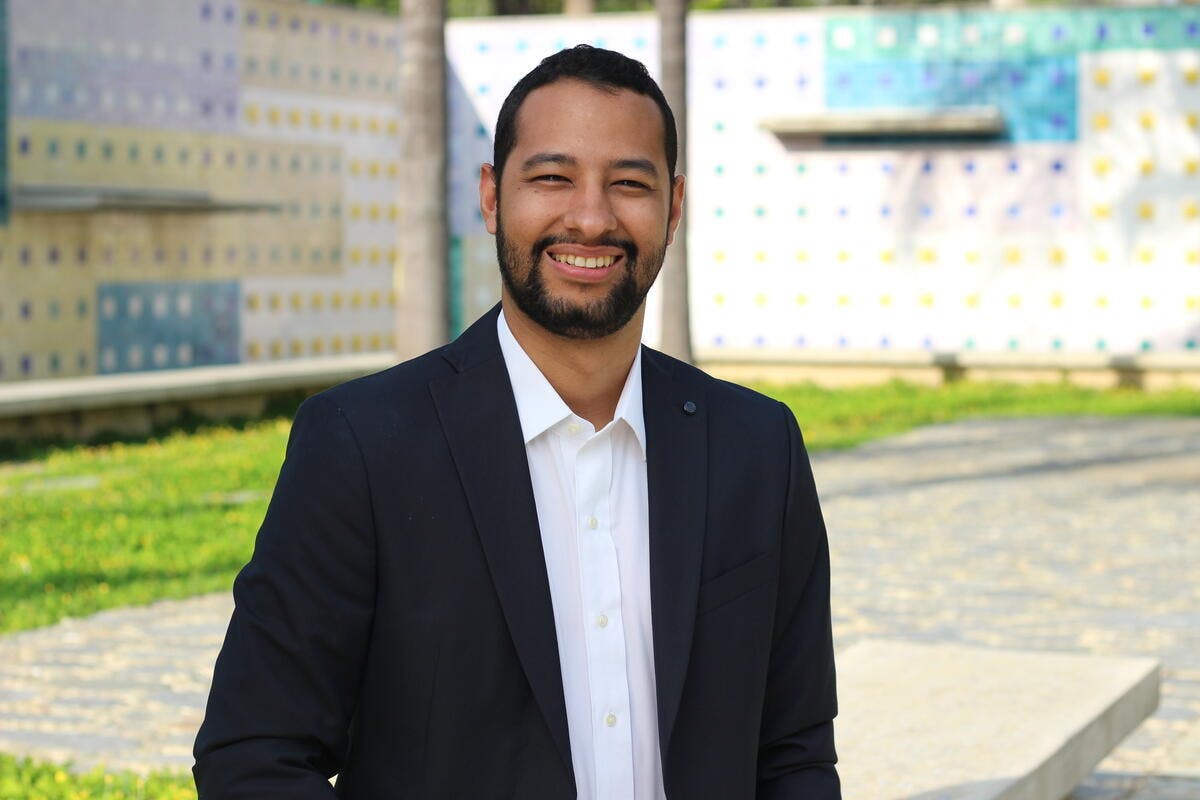 Gustavo Castillo smiling towards the camera.