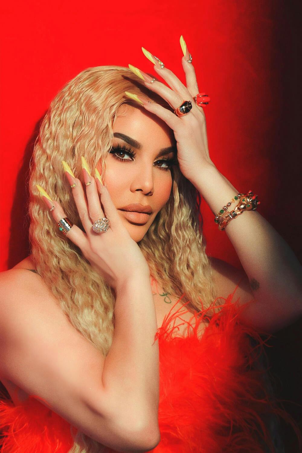 Ivy Queen looking at the camera while her hands surround her face