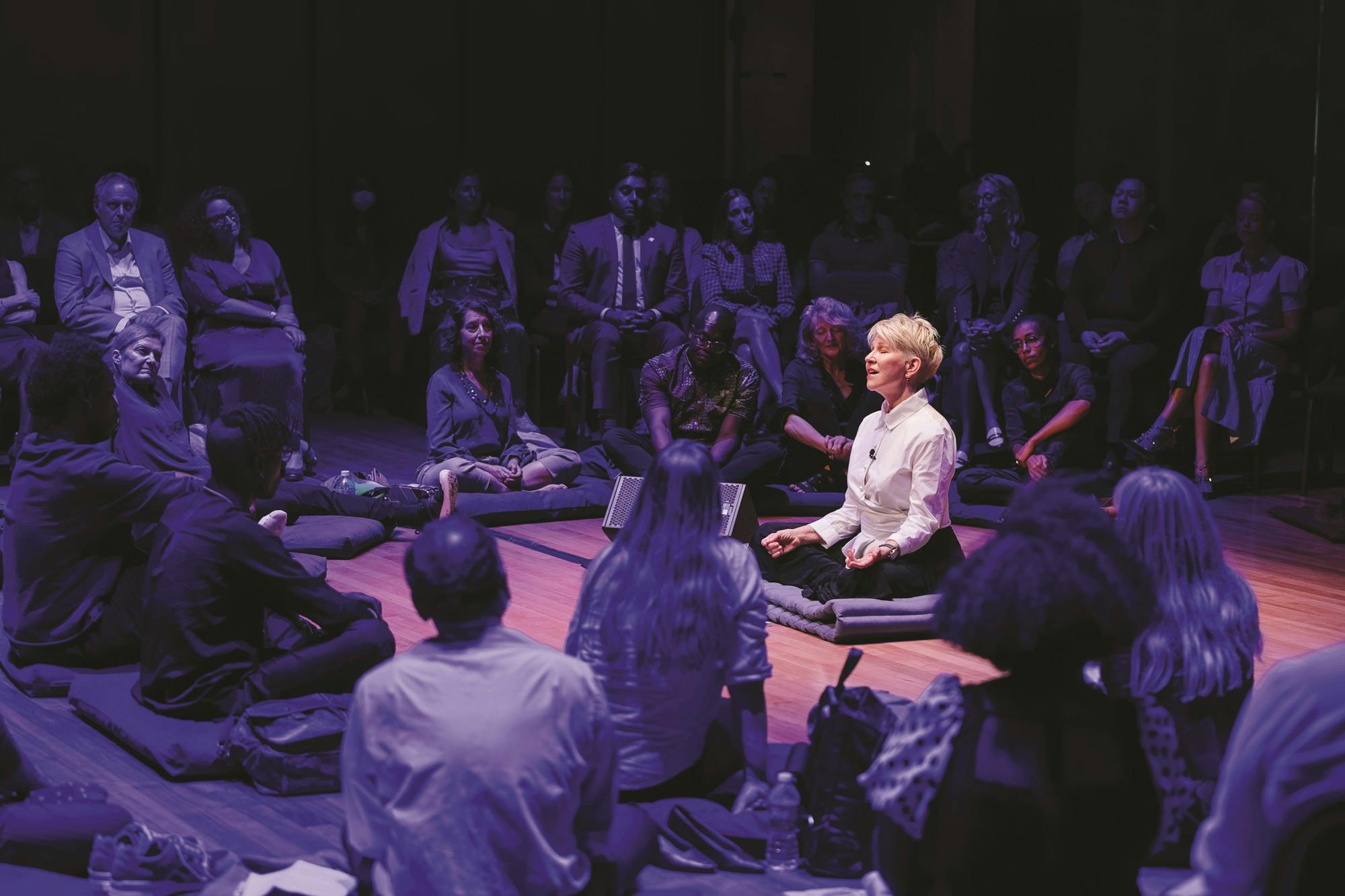 Joyce DiDonato sitting in the center of the Weill Music Room surrounded by the audience during a Well-Being Concert.